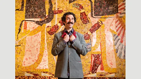 Michael Rakowitz/Photo: John Nguyen/PA Wire/Courtesy Whitechapel Gallery Michael Rakowitz in front of The Invisible Enemy Should Not Exist (Northwest palace of Nimrud, Room N), 2018