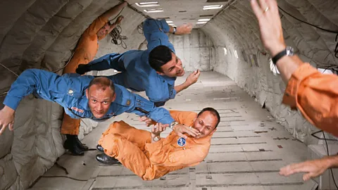 Ralph Morse/Time & Life Pictures/Getty Images/Taschen 1964: new astronauts Ted Freeman, Buzz Aldrin (centre), and Charlie Bassett experience zero gravity in Nasa’s KC135 aircraft – affectionately known as the Vomit Comet