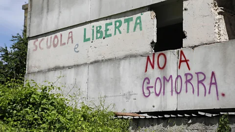 Alamy Graffiti referring to Gomorrah is scrawled on a wall in Naples, where the TV series was filmed (Credit: Alamy)