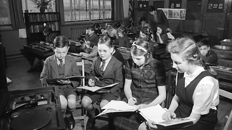 1945 tv Broadcasts To Schools: The senior pupils of a small rural school listen to a current affairs broadcast.