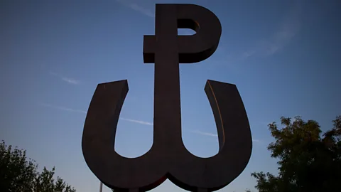 Adam Guz/Getty Images Symbols of the Warsaw Uprising, including the Kotwica, are still visible throughout the city (Credit: Adam Guz/Getty Images)