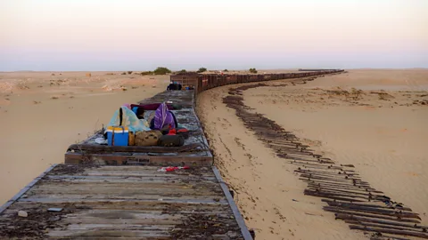 Novarc Images/Alamy Many Mauritanians choose to ride in the freight cars free of charge (Credit: Novarc Images/Alamy)