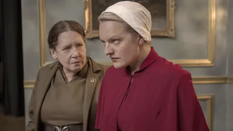 MGM/ Hulu Aunt Lydia with Offred in the TV adaptation of The Handmaid’s Tale – Lydia is one of three narrators in The Testaments (Credit: MGM/ Hulu)