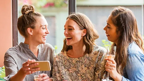 Getty Images Women tend to overpercieve the attractiveness of their close female friends, compared to strangers (Credit: Getty Images)