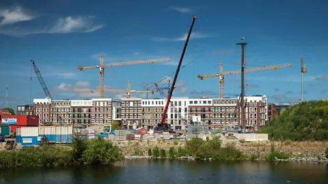 Alamy In high-growth cities including Amsterdam, some developers are building less-family-friendly towers to accommodate demand, or subdividing high-occupancy units (Credit: Alamy)