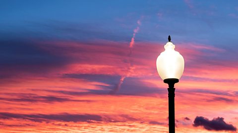 A street lamp against a pretty sunset.