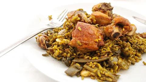 Dan Convey Though paella is often associated with seafood, traditional paella valenciana is made with meat, rice, snails and beans (Credit: Dan Convey)