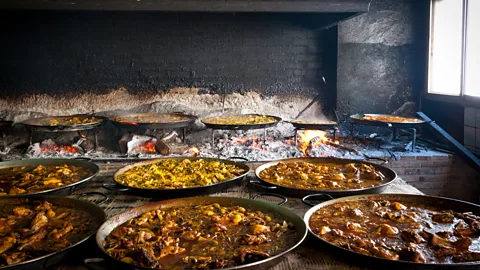 david010167/Getty Images La Pepica still prepares its paella over an open flame, like Valencia's early farmers (Credit: david010167/Getty Images)