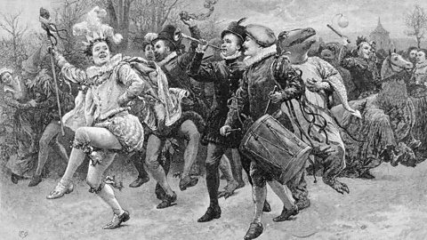 An illustration of the Lord of Misrule leading villagers around 1600.