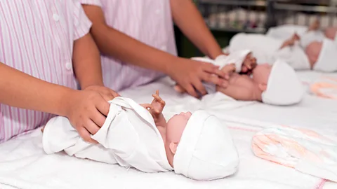 Getty Images Depending on the conversations these infants hear from a young age, they may go on to have very different lives (Credit: Getty Images)