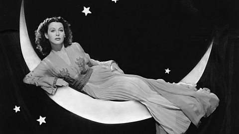 Hedy Lamarr lay on a crescent moon shape.