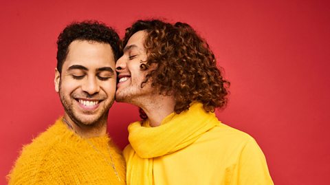 Two men snuggling