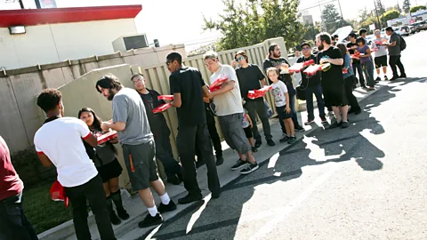 Getty Images Patrons queue to meet famous YouTube personalities at a launch event for Pizza Hut's Stuffed Cheez-It pizza in Hollywood in September (Credit: Getty Images)