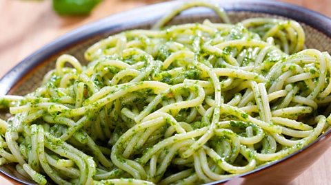 A bowl of pesto pasta.