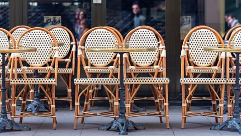 AlxeyPnferov/Getty Images Paris’ sidewalk cafes almost exclusively feature chairs that face outwards, towards the moving, living city (Credit: AlxeyPnferov/Getty Images)