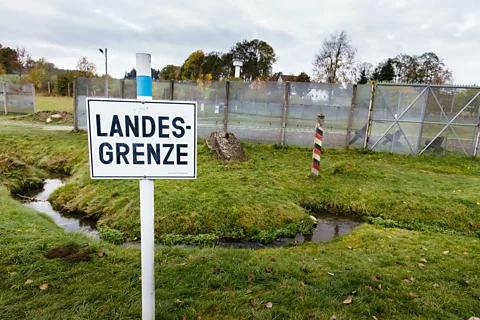 Joerg Steber/Getty Images The small Tannbach stream that runs through Mödlareuth once marked the border between East and West Germany (Credit: Joerg Steber/Getty Images)