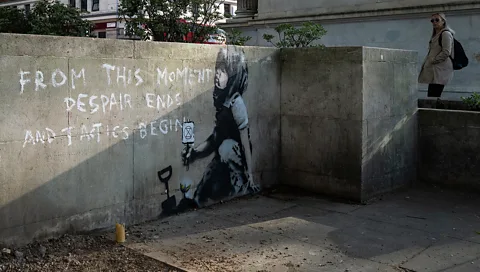 Getty Images A mural believed to have been made by Banksy – featuring the logo of climate-change activist movement Extinction Rebellion – appeared in London in April 2019