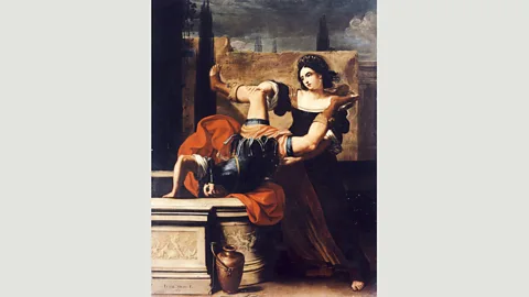 Alamy Timoclea’s story was told by Plutarch; in Sirani’s painting she is exacting revenge on a soldier who raped her (Credit: Alamy)
