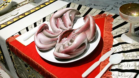 Getty Images Judy Chicago's installation The Dinner Party (now in Brooklyn Museum) features vulva-shaped plates (Credit: Getty Images)
