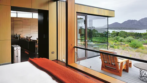 David de Vleeschauwer A bedroom at Saffre Freycinet opens out on to a breathtaking view (Credit: David de Vleeschauwer)