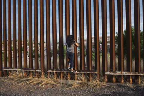 Steve McCurry The author first ventured to Mexico via Nogales, where a fence separates many families along the US-Mexico border (Credit: Steve McCurry)