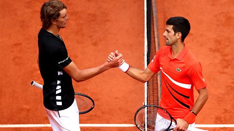 Tennis players Novak Djokovic and Alexander Zverev shake hands following their mens singles quarter-final match