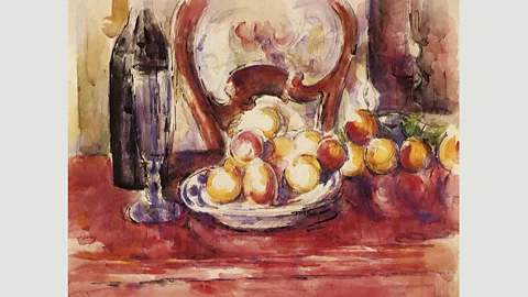 Alamy According to the art critic Robert Hughes, Apples, Bottle, and a Chairback belonged to ‘the most joyous part’ of Cézanne’s life’s work (Credit: Alamy)