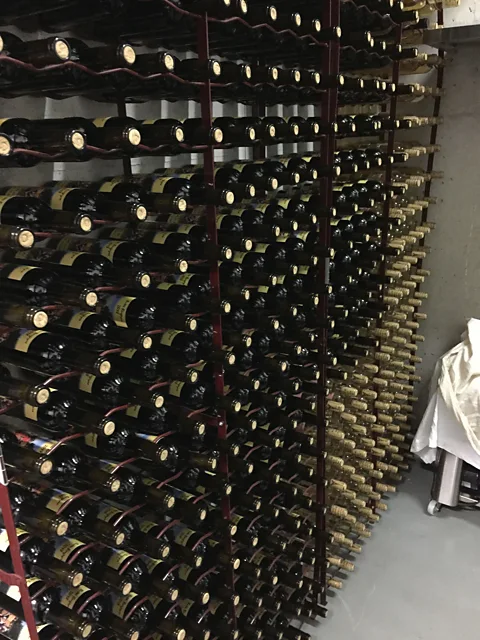 Addison Nugent The Butte Bergeyre’s small wine cellar contains all the bottles that will be auctioned each autumn (Credit: Addison Nugent)