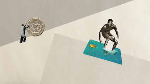 Javier Hirschfeld/Getty Images/Alamy We find it much easier to spend on plastic than we do cash (Credit: Javier Hirschfeld/Getty Images/Alamy)