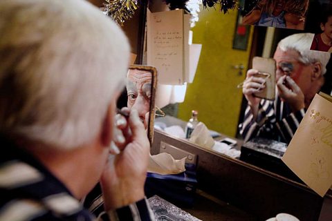 Kenneth Alan Taylor puts on his make-up ready to play Dame Daisy.