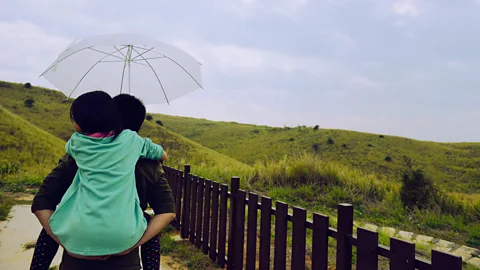 Getty Images Amae may be a way for adults to escape from the stress of their responsibilities but may also have its roots in the way they were treated as children (Credit: Getty Images)