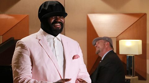 Gregory Porter performing with piano accompaniment