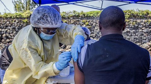 Someone receiving an Ebola vaccine