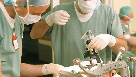 Getty Images The surgery needed to implant electrodes for deep brain stimulation is highly invasive and can bring other complications (Credit: Getty Images)