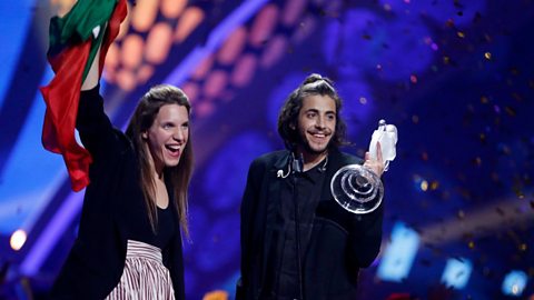 Salvador Sobral holding the Eurovision trophy.