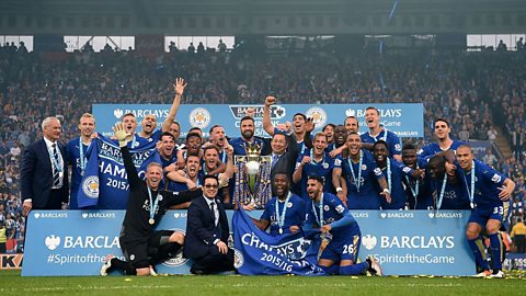 Leicester City team and the Premier League trophy.