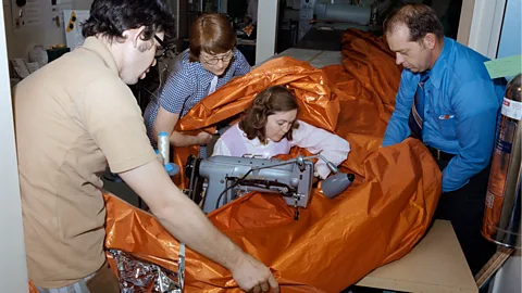 Nasa A picture of Aylene Baker stitching part of a heat shield is on display at Nasa's Johnson Space Center (Credit: Nasa)