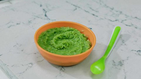 Pea and leek puree in a small bowl.