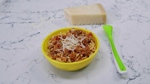 A small bowl of baby friendly bolognese.