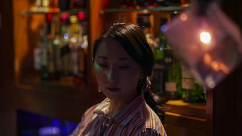 Shiho Fukada and Keith Bedford Miki Tateishi is a bartender at Hitori, a bar aimed at solo drinkers. A former customer herself, she thinks "the world is changing" (Credit: Shiho Fukada and Keith Bedford)