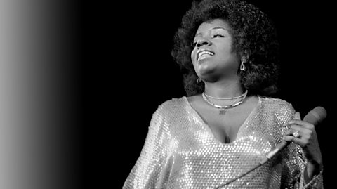 Gloria Gaynor photographed on stage.