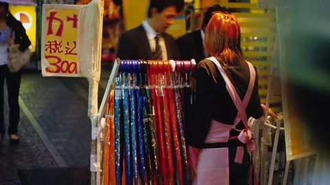 Getty Images Clear plastic umbrellas like these are so common and cheap in Tokyo that they are often "up for grabs", according to West (Credit: Getty Images)