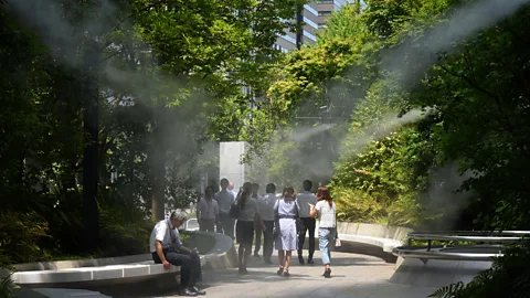 Alamy Fine sprays of mist are used in busy locations in Tokyo to help cool down pedestrians (credit: Alamy)