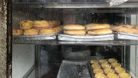 Mercedes Hutton Bing sutts would traditionally advertise their wares in the window, such as these pastries for sale at Hoi On Cafe (Credit: Mercedes Hutton)