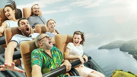 Six people screaming on a rollercoaster.