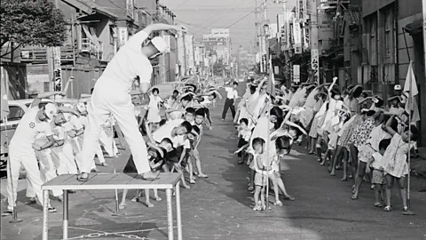 Getty Images Workers at the national postal service – all 20,000 of them – performed the routines on the streets each morning (credit: Getty Images)