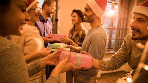 Friends exchanging gifts at Christmas