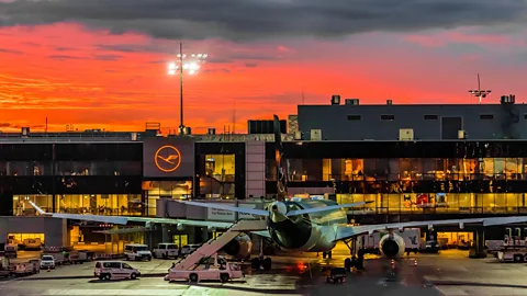 Alamy Sunrise at Frankfurt am Main Airport. Flight shaming has been a flashpoint for debate in Germany over the last year amid climate change concerns (Credit: Alamy)