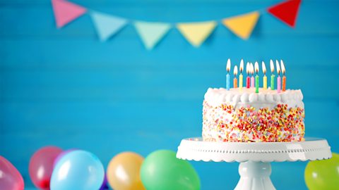 A photo of a birthday cake with candles.