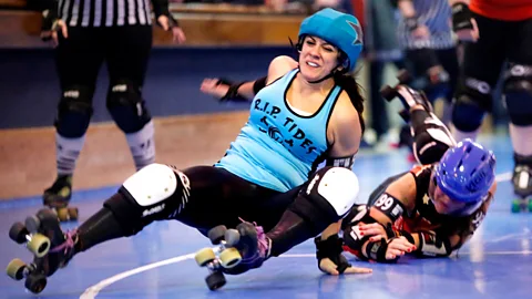 Getty Images Despite the protective gear and helmets, collisions between skaters in roller derby can still lead to serious head injuries (Credit: Getty Images)